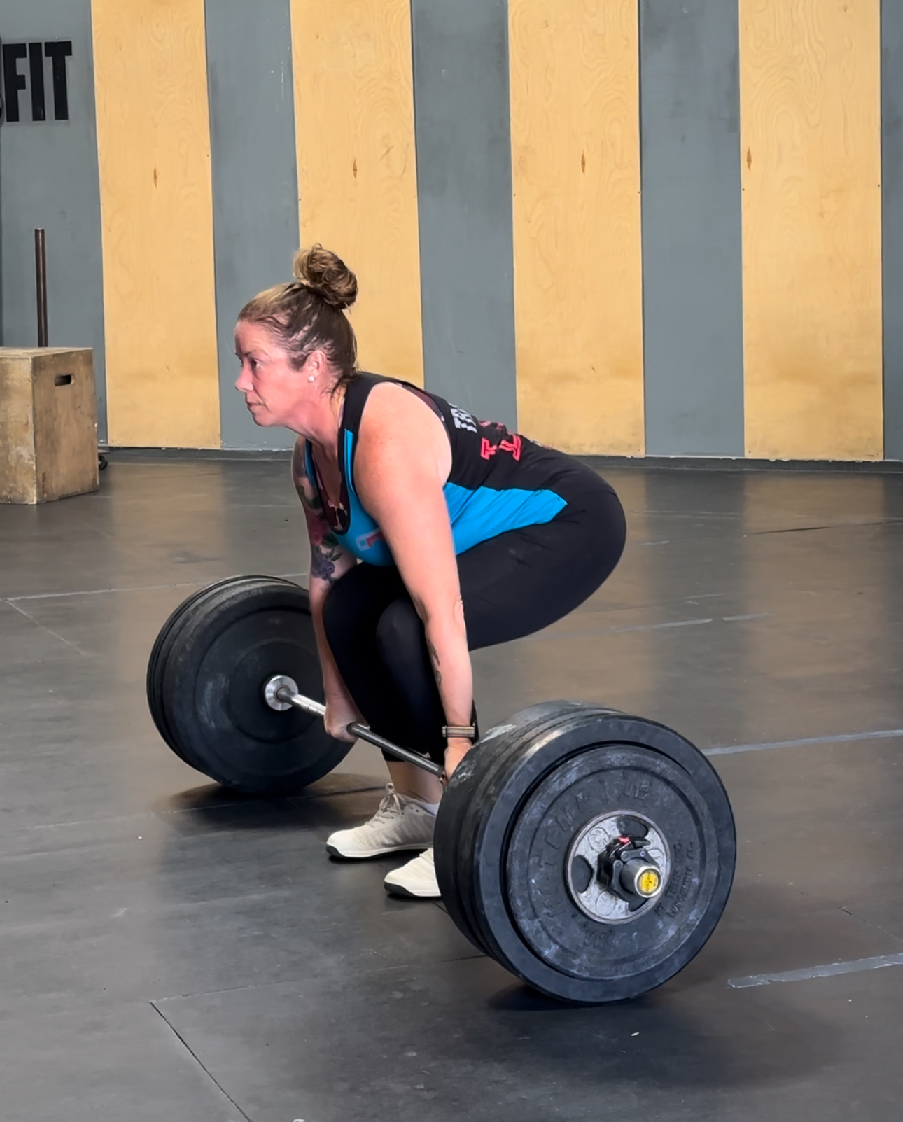 athlete ready to deadlift a loaded barbell