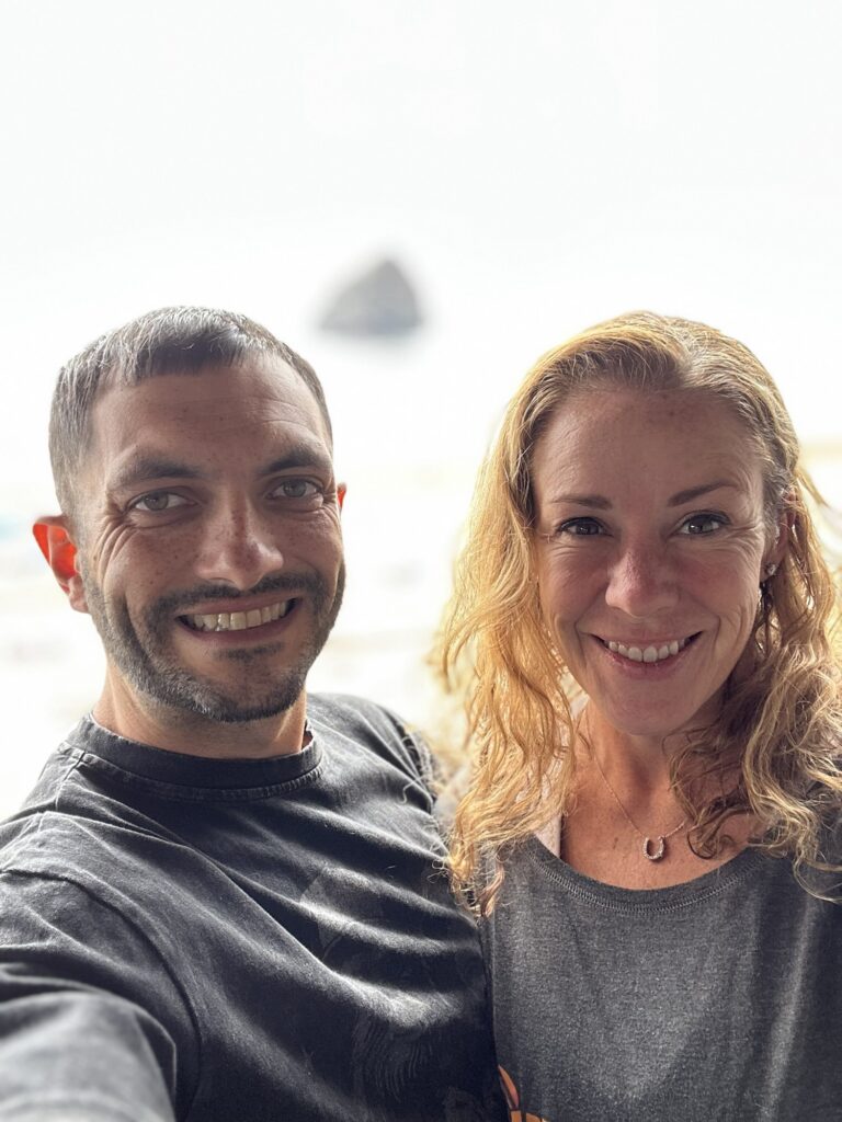 Amy and her partner Mason smiling together outdoors