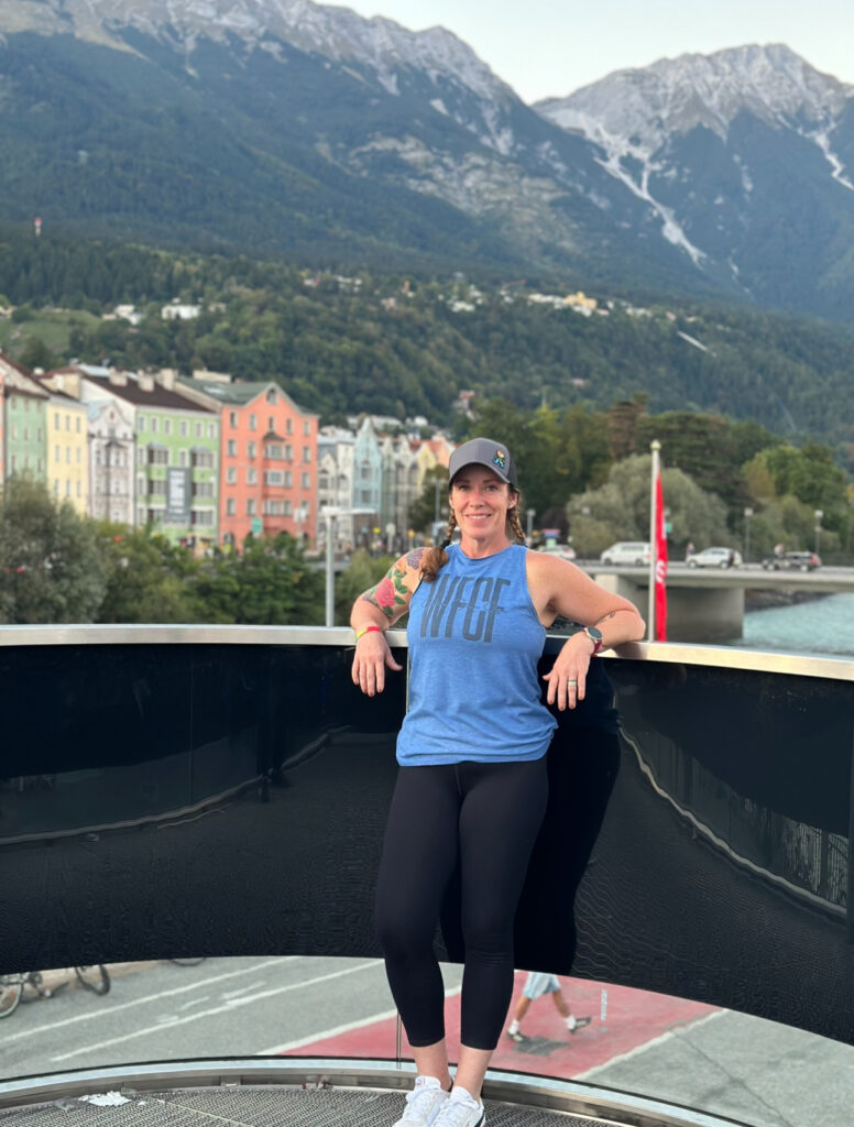 Amy on a balcony overlooking the mountains in Innsbruck
