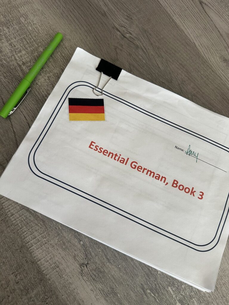Amy's German language workbook on the table